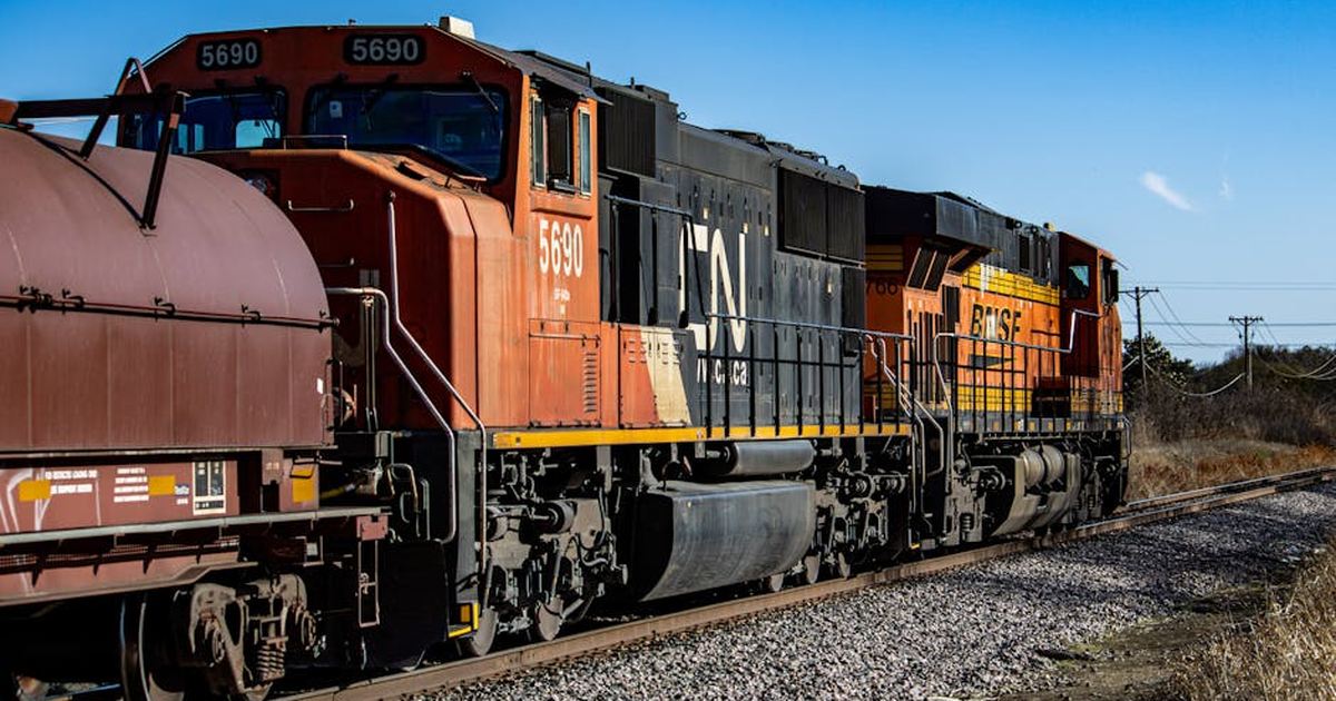 BNSF locomotive pulling a freight train on a railway track in Carrollton, Texas.