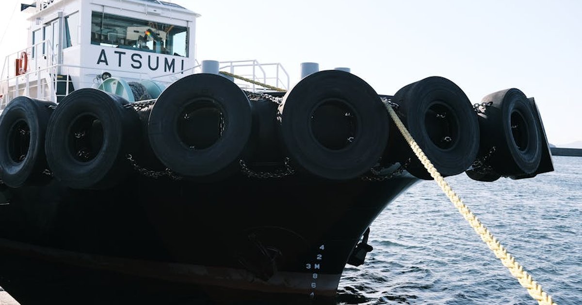 A close-up of tugboat Atsumi moored at Gamagōri Harbor, Japan.
