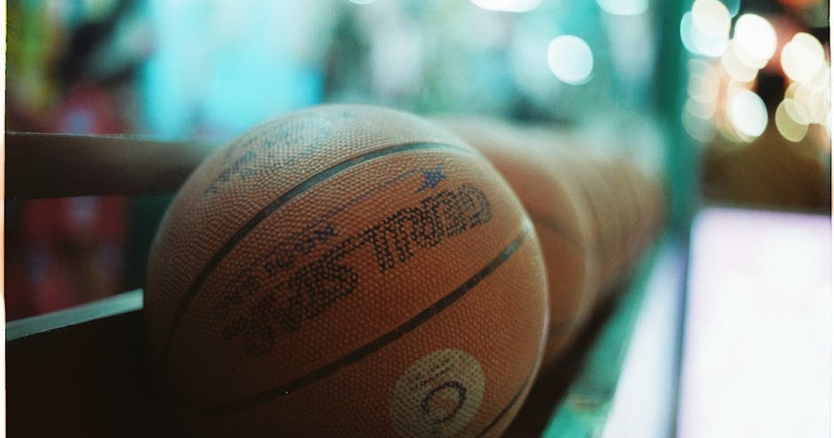 A closeup shot of basketballs with vibrant, colorful bokeh, evoking a fun and energetic mood.