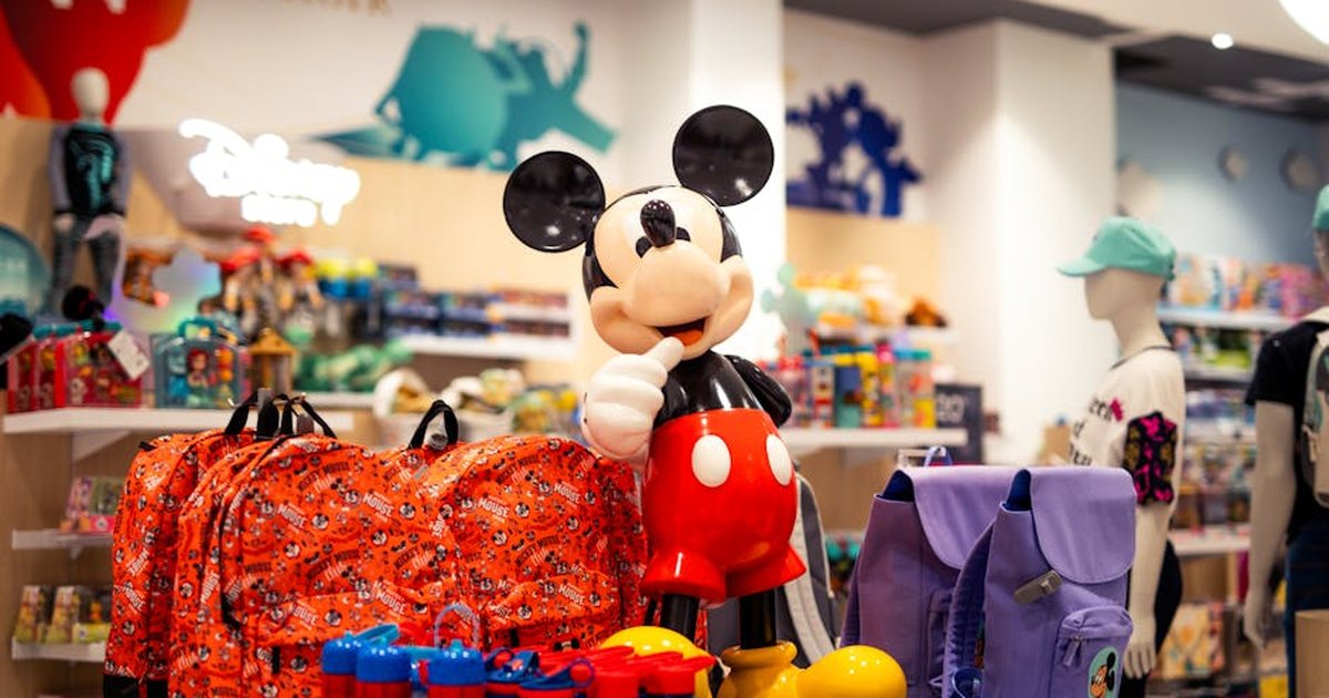 A vibrant retail display featuring Disney-themed merchandise with a prominent Mickey Mouse figure.