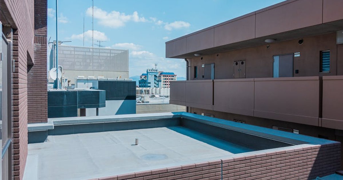 Explore modern architecture from a rooftop perspective in Fukuoka, Japan.