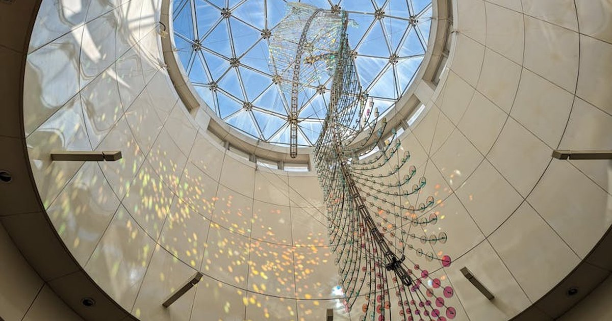 A stunning view of a light-reflective art installation within a geometric skylight in New Taipei City, Taiwan.