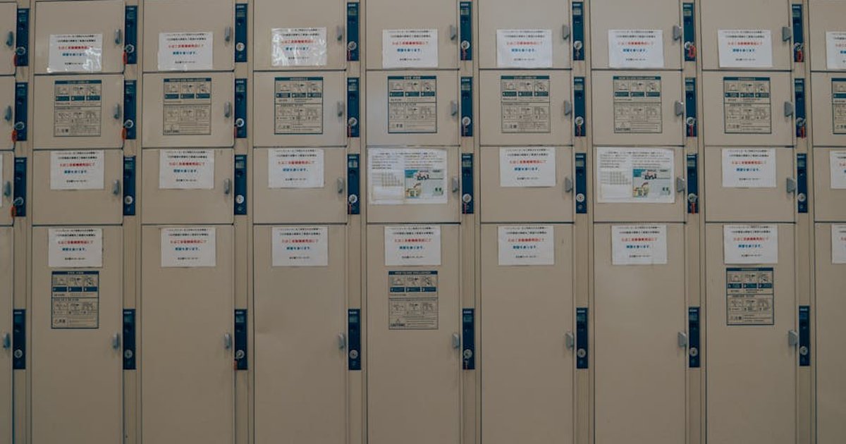 A row of lockers with notices in a Japanese school corridor in Nagoya.