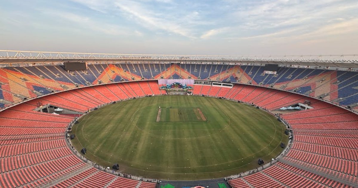 Wide-angle aerial view of the iconic Narendra Modi Stadium in Ahmedabad, India, at day.