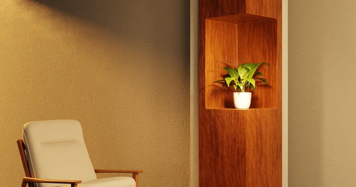 Modern interior design featuring a stylish armchair and a potted plant in a wooden niche.