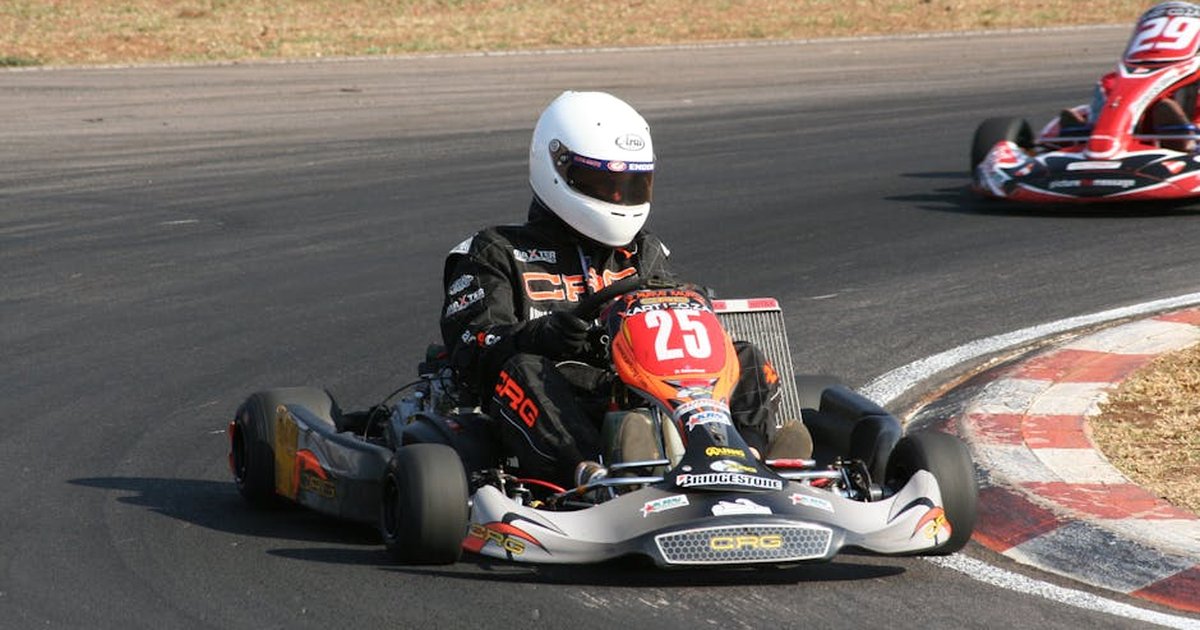 Energetic go-kart racers in action on an outdoor race track during a thrilling competition.