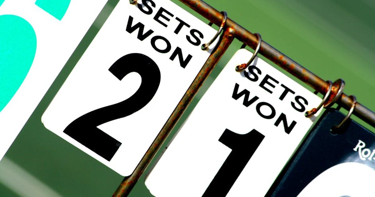Close-up of a tennis scoreboard showing games won by each player.