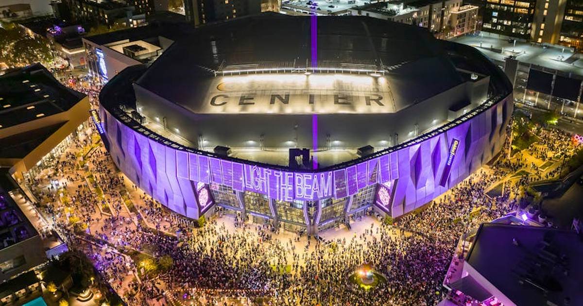 Vibrant aerial night view of a crowded stadium with illuminated surroundings in Sacramento, California.