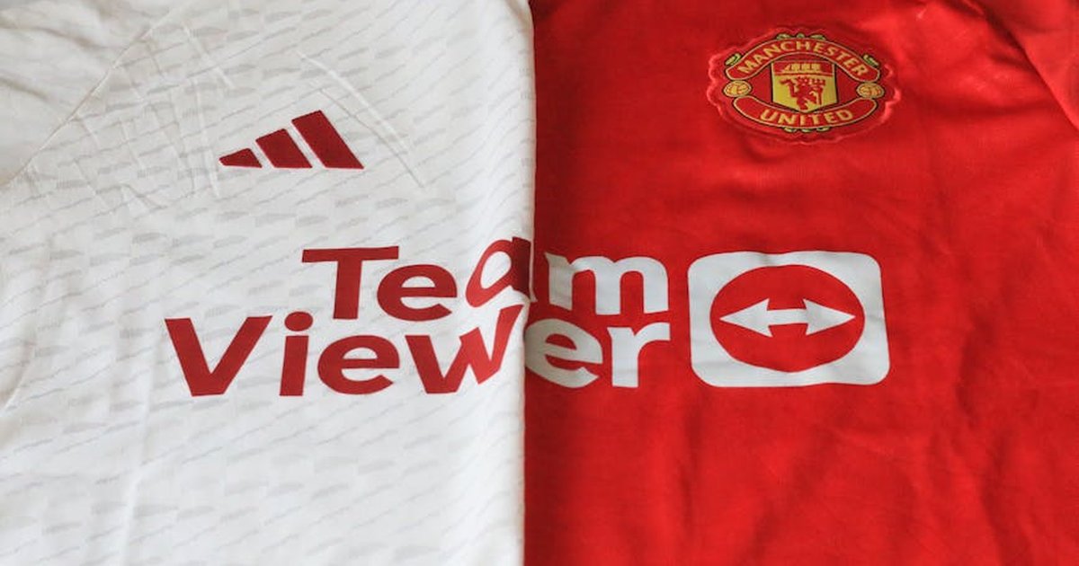 Close-up of Manchester United 2023 jerseys showcasing red and white designs.