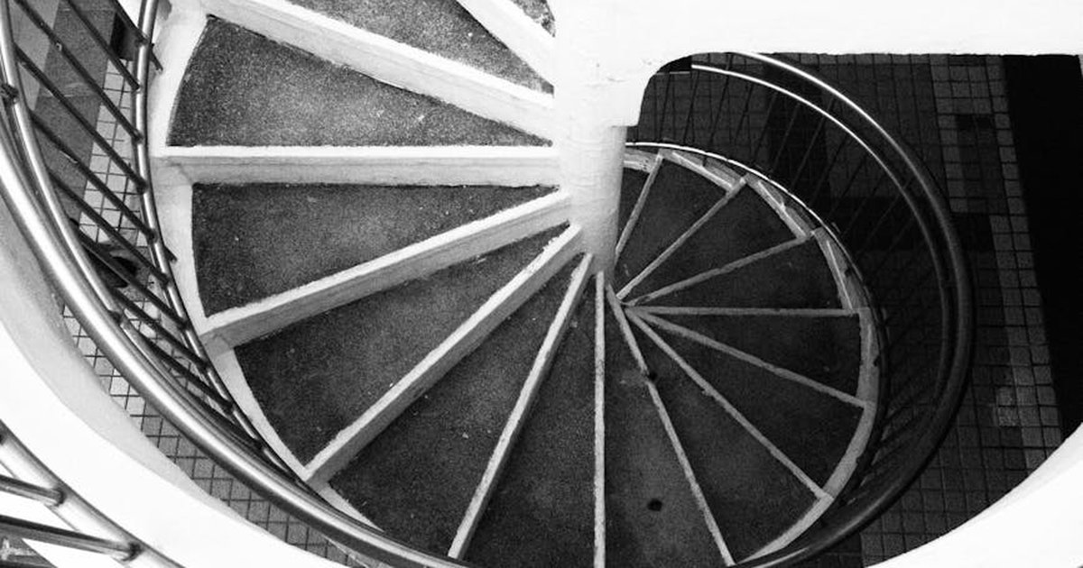 Artistic monochrome image of a spiral staircase in Hong Kong.