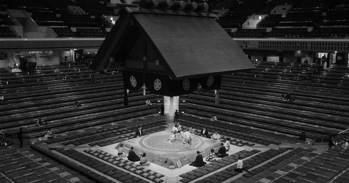 Black and white photo of a sumo wrestling match in Tokyo, Japan.