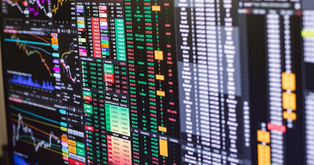 Detailed financial trading screen with colorful charts and data representing market fluctuations.