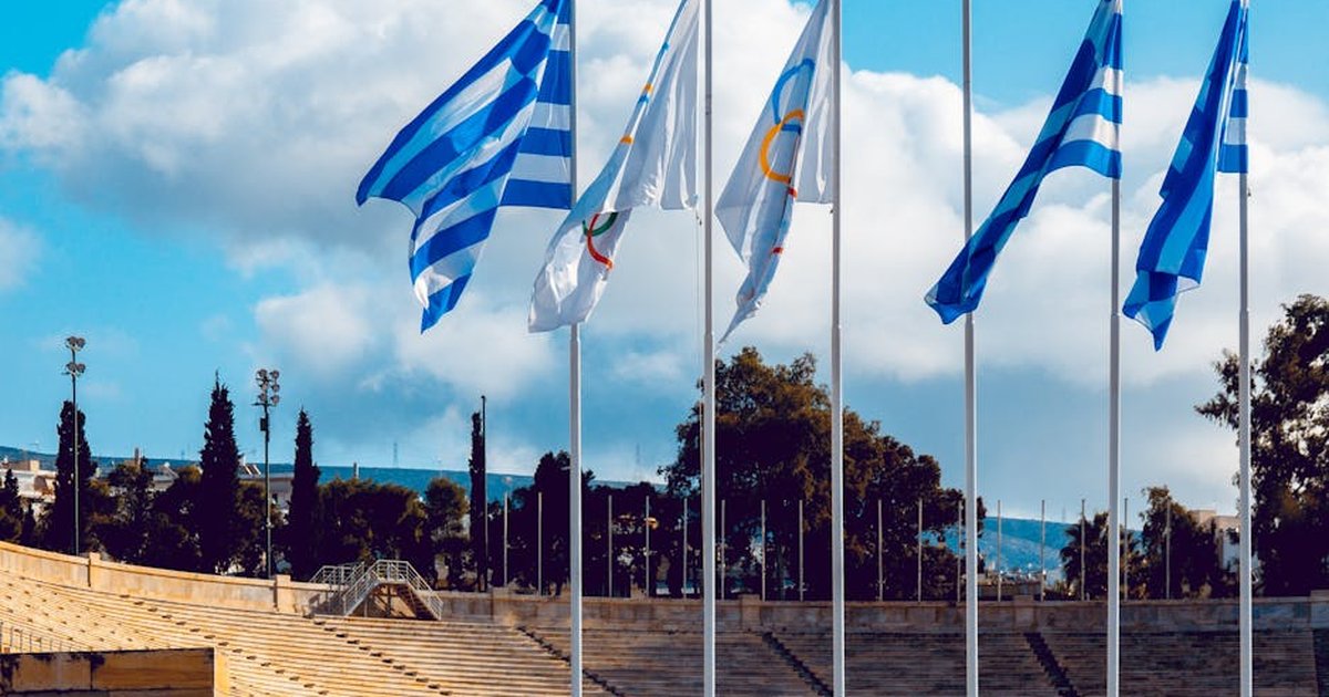 A view of Greek flags waving at the historic Panathenaic Stadium in Athens, Greece.