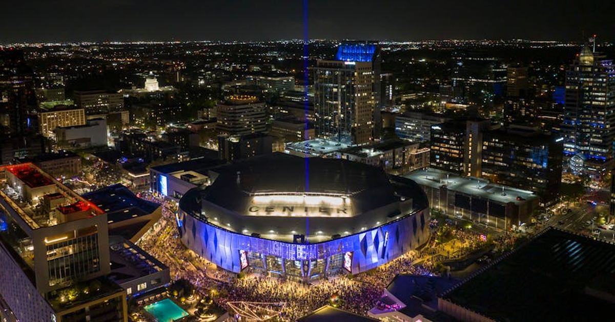 Aerial view of Golden 1 Center illuminated at night in downtown Sacramento, California.