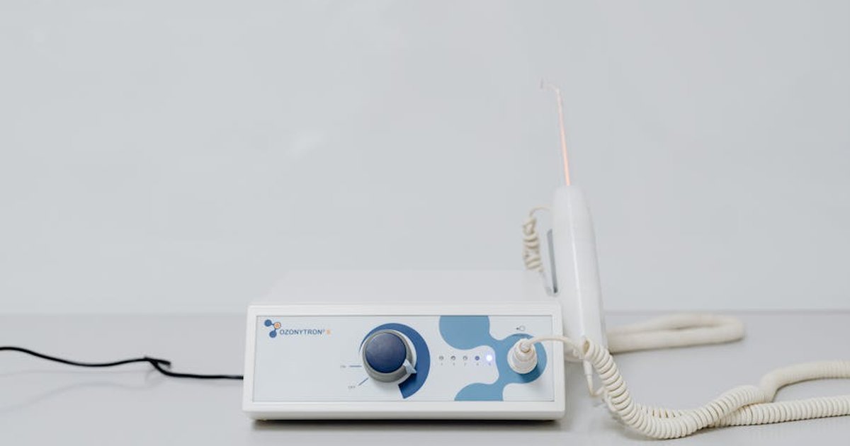 A high-tech ozone therapy device with a minimalistic design on a white background.