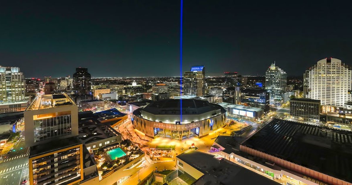 Stunning nighttime aerial shot of downtown Sacramento, featuring city lights and skyline architecture.