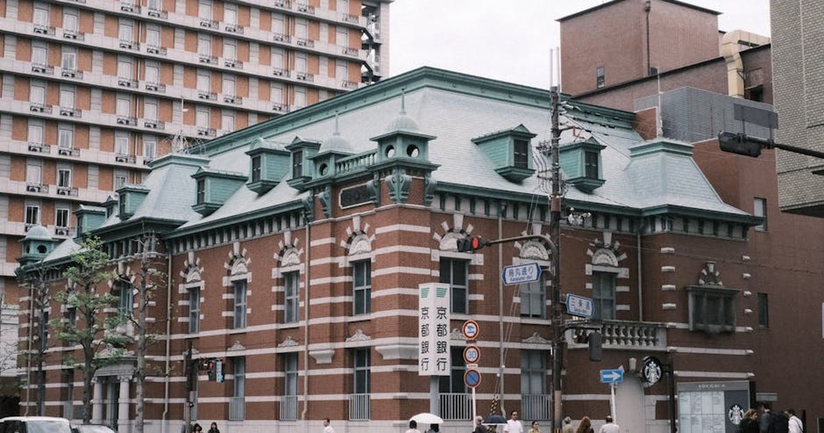 A European-style historic building in a bustling urban area of Kyoto, Japan.