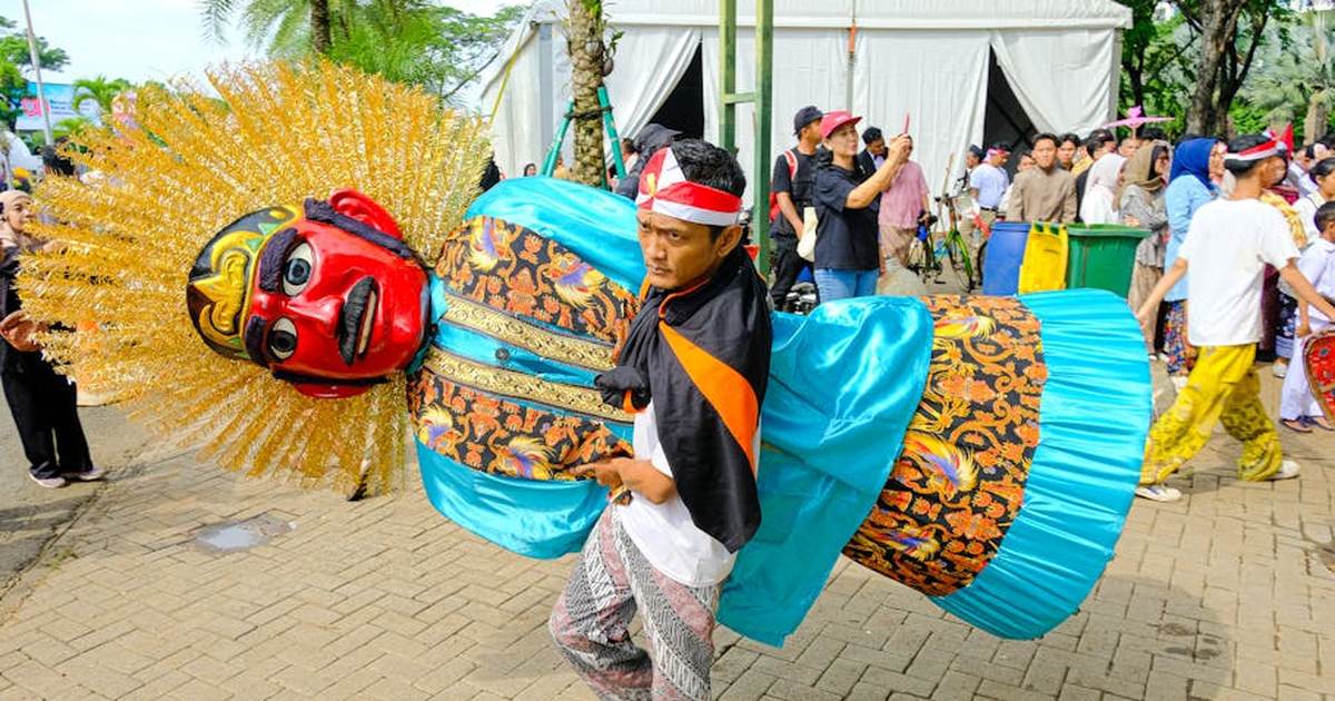 Cultural celebration with Ondel-Ondel figures in Jakarta, Indonesia.