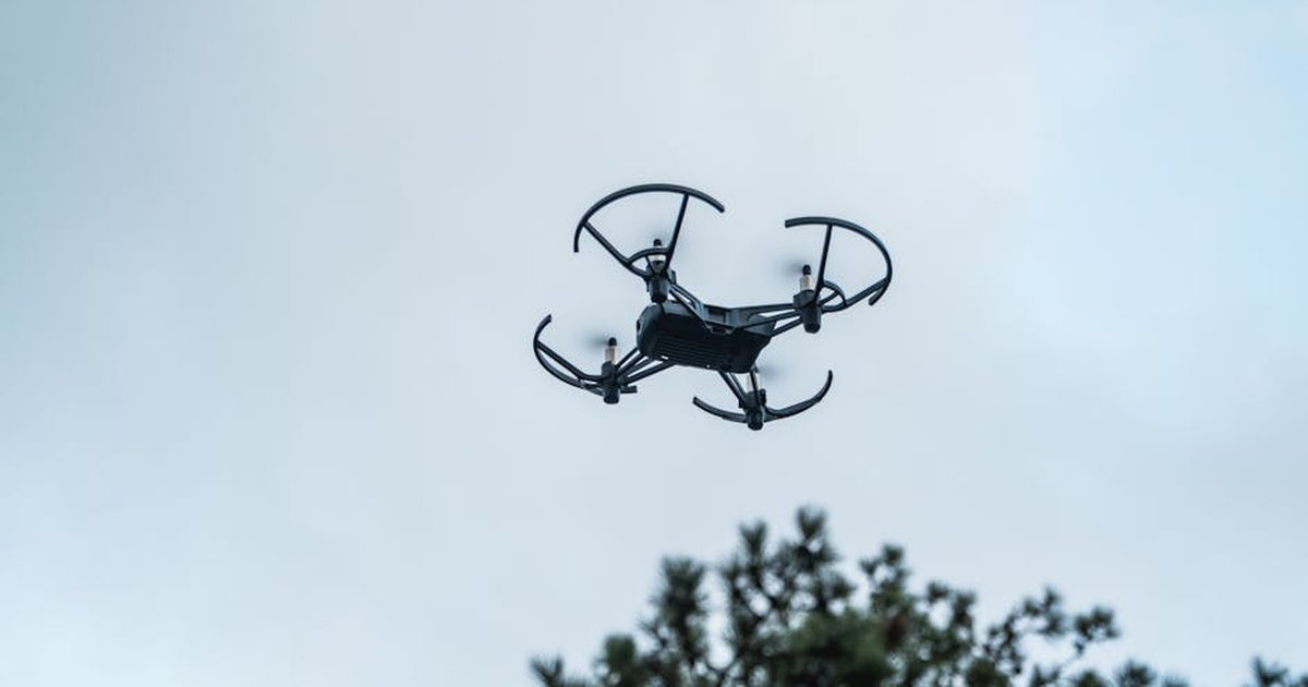 A drone captured in mid-flight against a clear sky in Istanbul, Turkey.