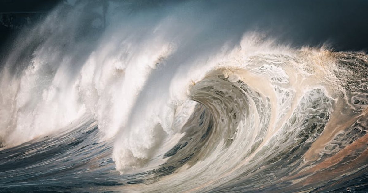 Captivating image of massive ocean waves breaking on the shore, creating a dramatic scene.