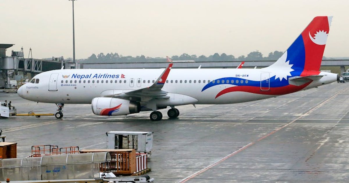 Nepal Airlines Airbus A320 stationed on airport runway, ready for departure.