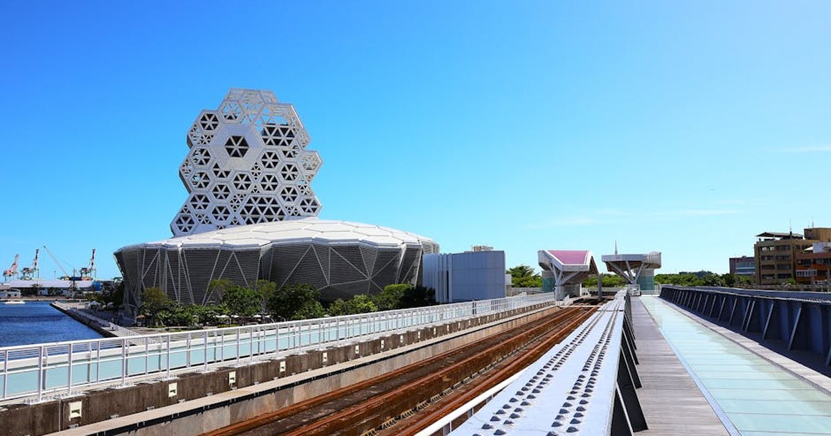 Explore stunning modern architecture against a clear sky in Kaohsiung, Taiwan.