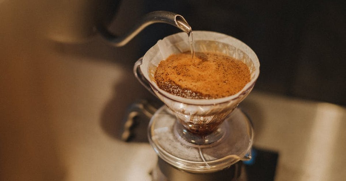 Close-up of pour-over coffee preparation in a Shinjuku café, Tokyo, Japan.
