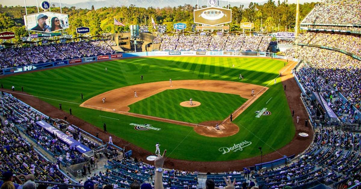 A lively baseball game at Los Angeles' iconic Dodger Stadium, capturing the vibrant atmosphere and full crowd.