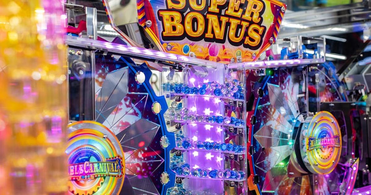 Colorful neon arcade machine featuring a 'Super Bonus' display with bright lights and playful design.