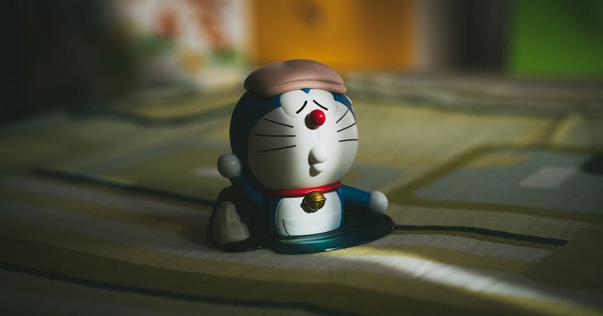 A Doraemon toy figurine with soft lighting and shadows, creating a vintage look.
