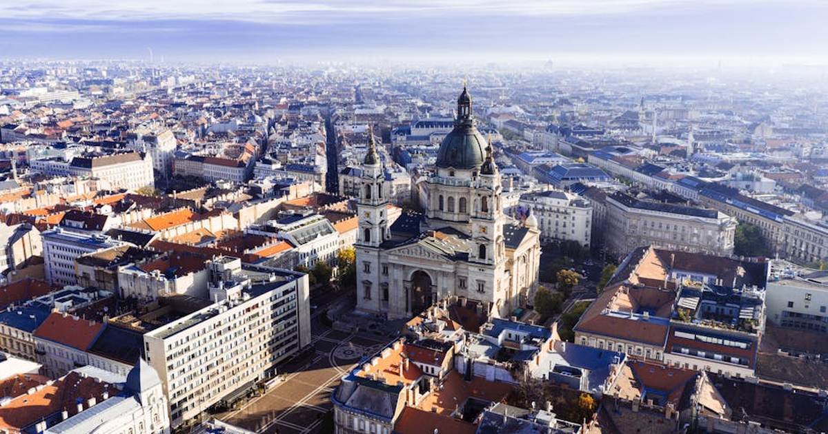 Stunning aerial view of St. Stephen's Basilica in Budapest with cityscape backdrop.