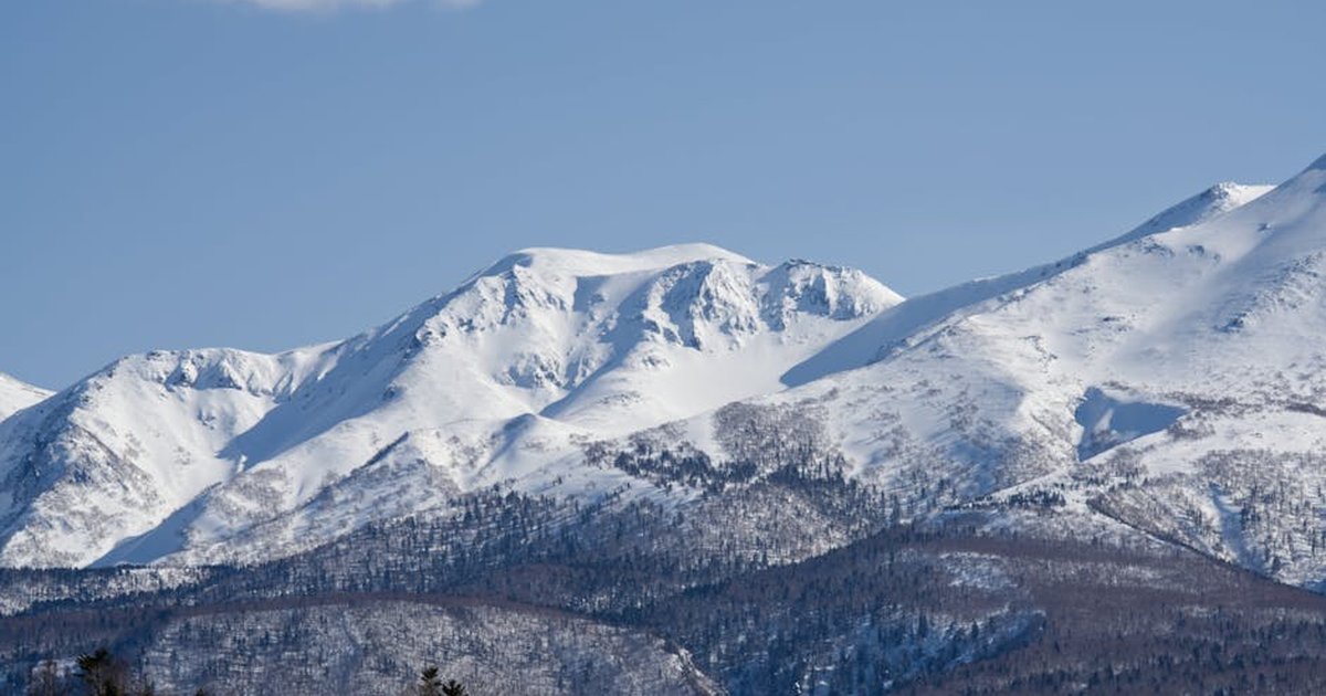 Breathtaking view of snowcapped Mount Asahi in Hokkaido, Japan during winter.