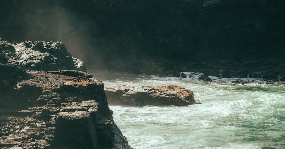 Stunning view of rugged cliffs and waves at Acantilados de Los Gigantes, Spain.