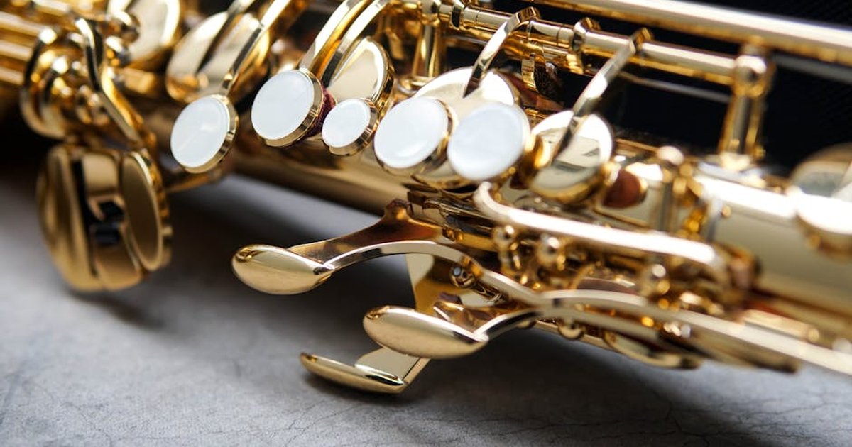 Detailed close-up of saxophone keys showcasing intricate brass craftsmanship.