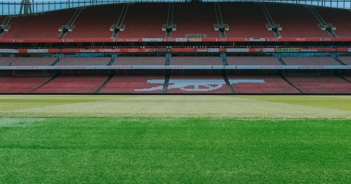 A view of the empty stands and football pitch at Emirates Stadium, London.