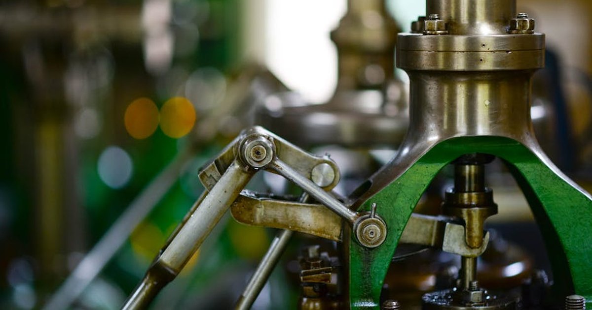 Detailed view of mechanical components in an industrial setting, showcasing metal gears and levers.