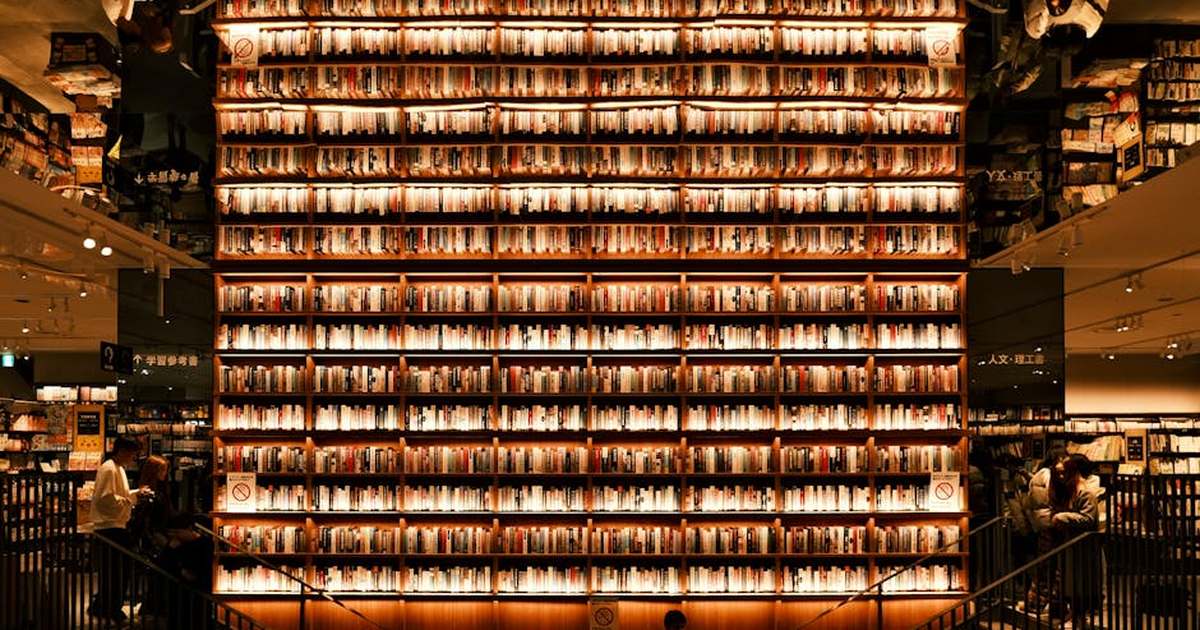 Bookshelf display with warm lighting in Nagoya, Japan bookstore interior.