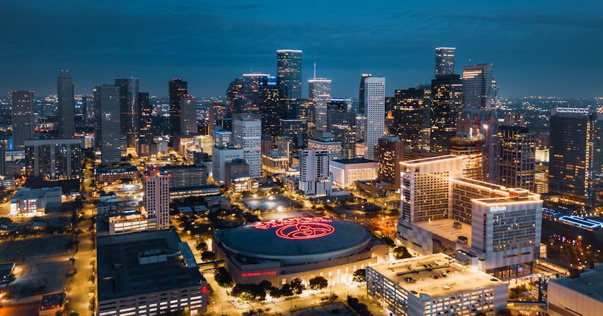Stunning aerial panorama of Houston's illuminated skyline at night showcasing modern skyscrapers.