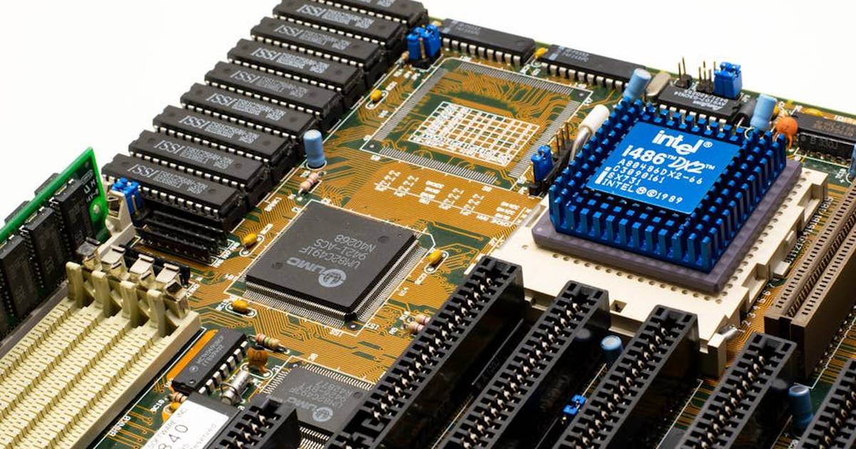 Close-up of vintage Intel 486DX2 CPU on a classic motherboard with electronic components.