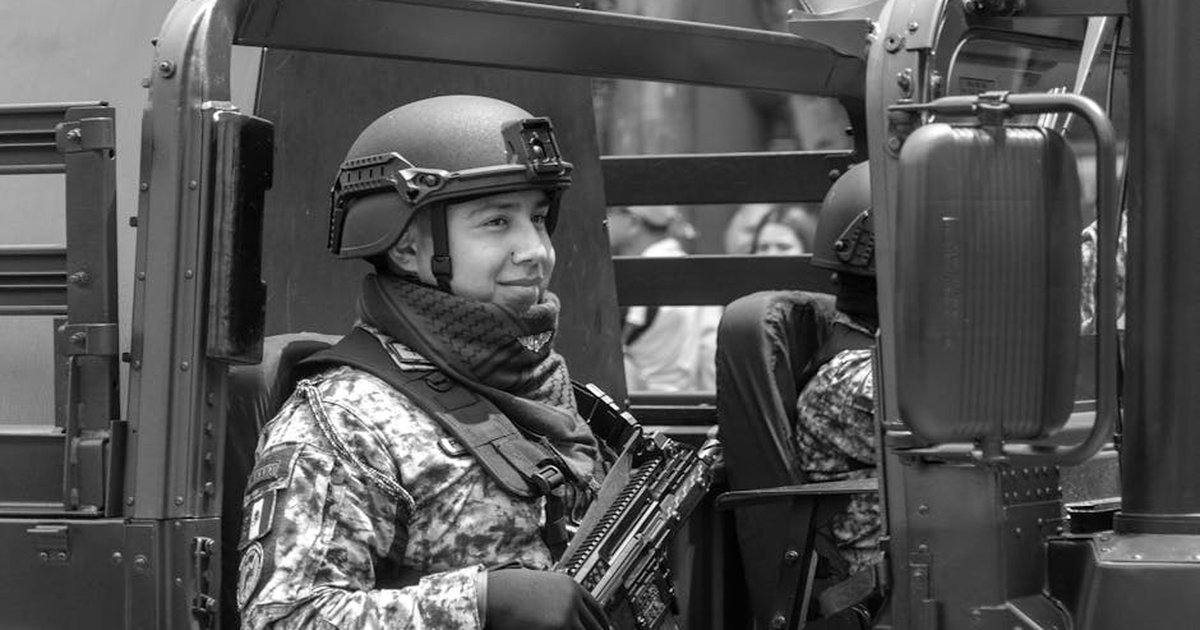 Mexican military officer in an armored vehicle during a Mexico City parade, showcasing national pride.