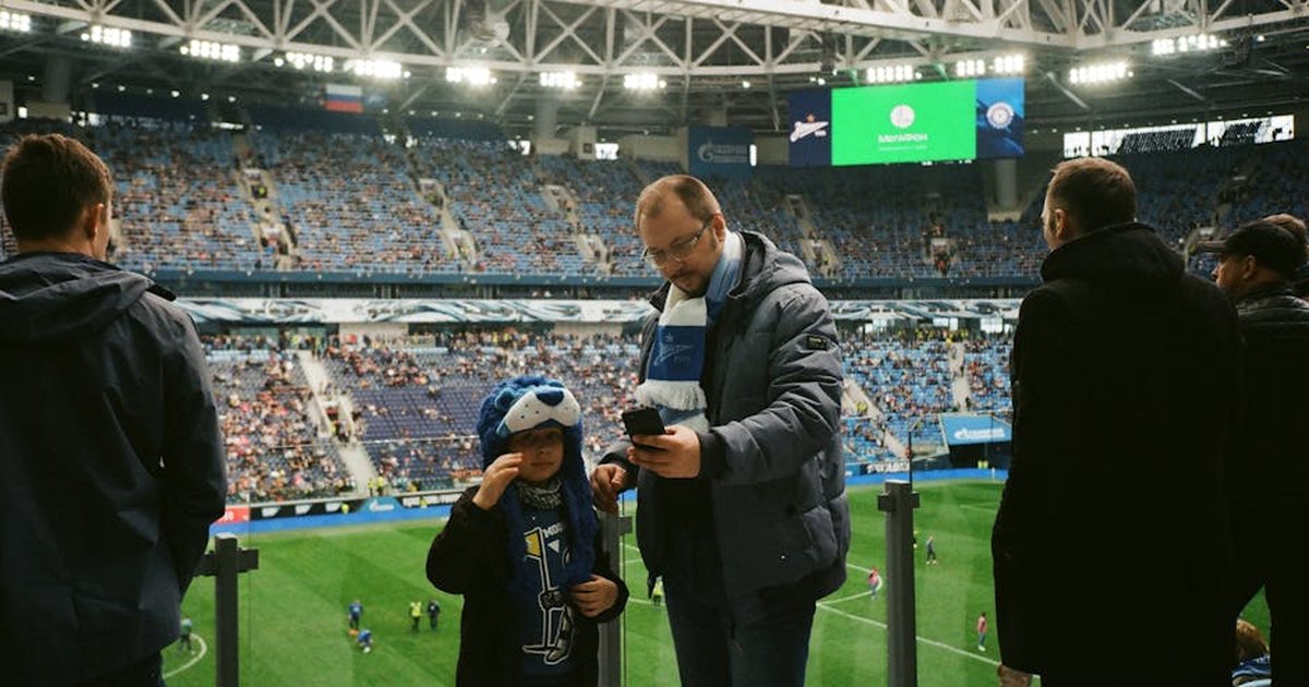 Crowd enjoying a football match in Saint Petersburg stadium, Russia.