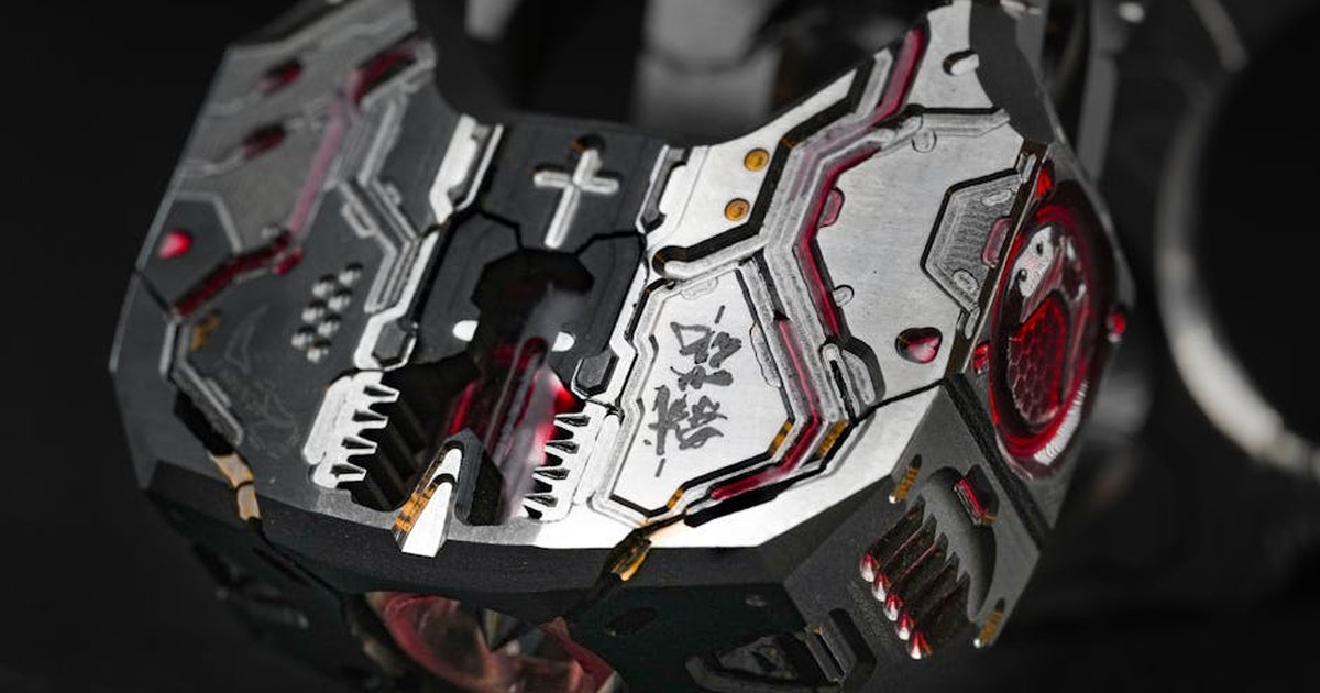 Close-up of a futuristic mechanical device showcasing intricate metalwork and design elements.