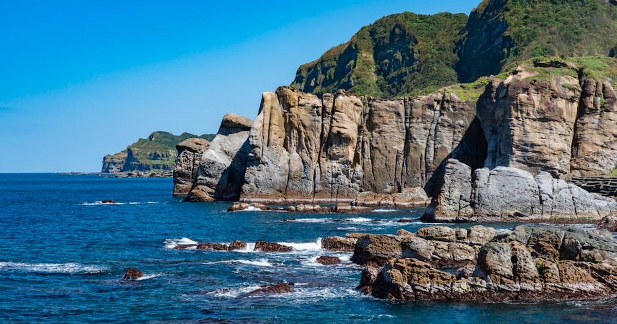 Stunning coastal cliffs with rocky shorelines and vibrant blue sea, perfect for nature lovers.