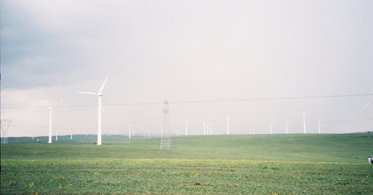 Expansive landscape with wind turbines in Inner Mongolia, China, promoting renewable energy.