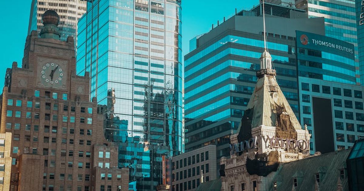 A stunning view of New York City skyscrapers including iconic buildings in bright daylight.