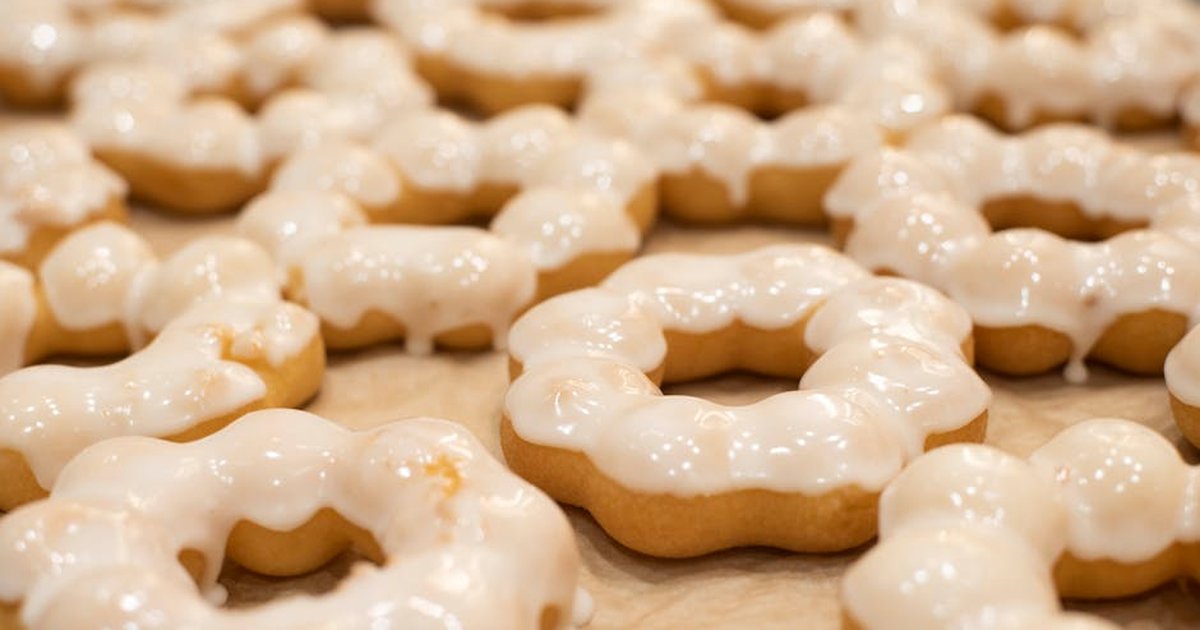 Close-up of freshly glazed mochi donuts, perfect for sweet indulgence.