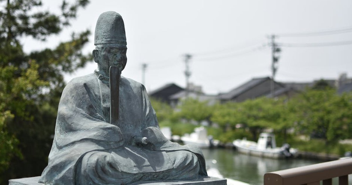 Close-up of a Buddha statue in Imizu City, Japan, capturing serene outdoor ambiance.