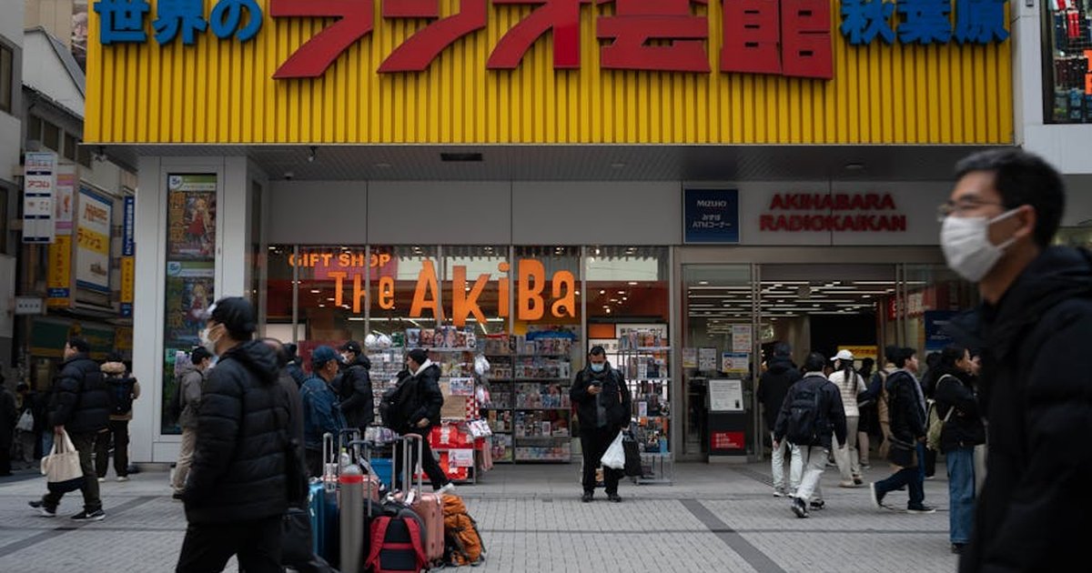 People shopping outside Akihabara Radio Kaikan in Tokyo, Japan.