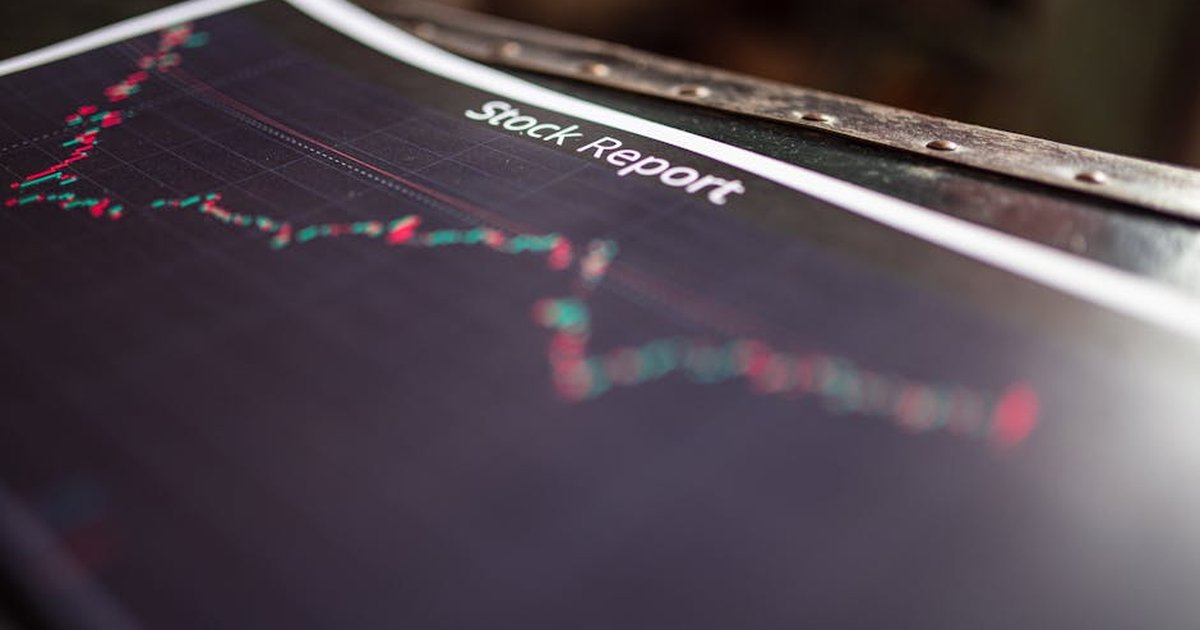 Detailed stock report showing market trends on paper charts.