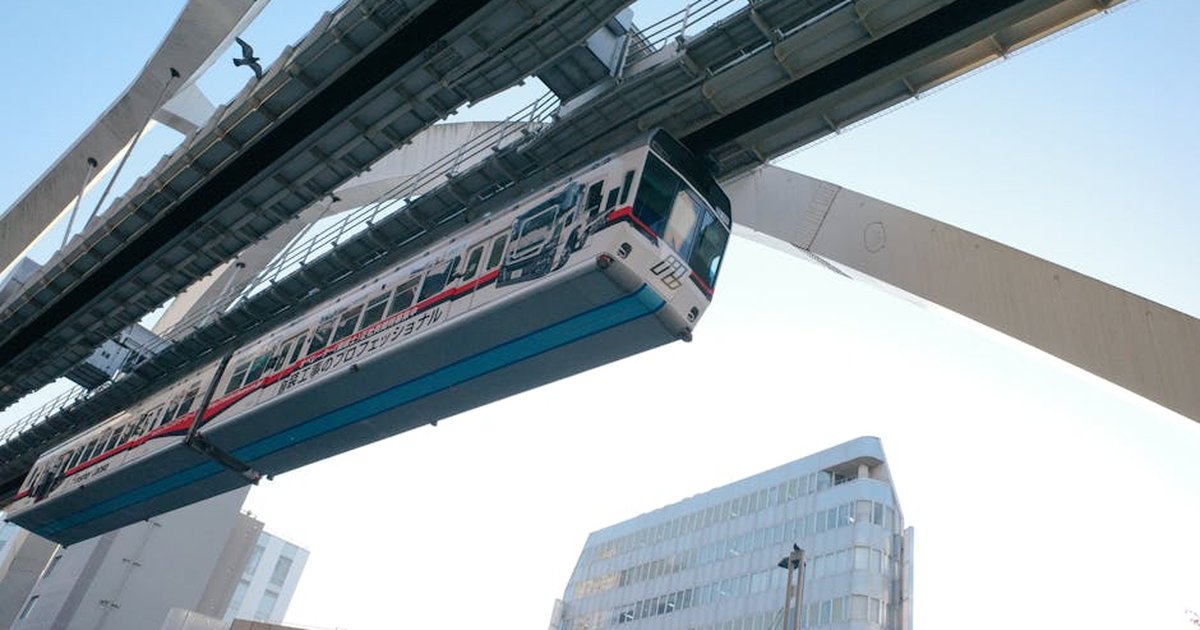 A modern monorail train passing through Chiba, Japan, showcasing urban infrastructure and transportation.